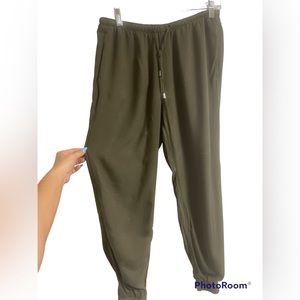 Small green drawstring joggers.